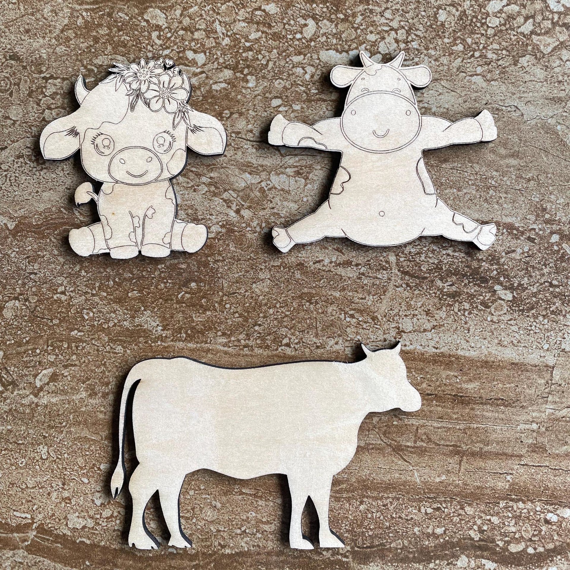 Handmade wooden DIY cow cutout in three unique styles, ready to paint or decorate