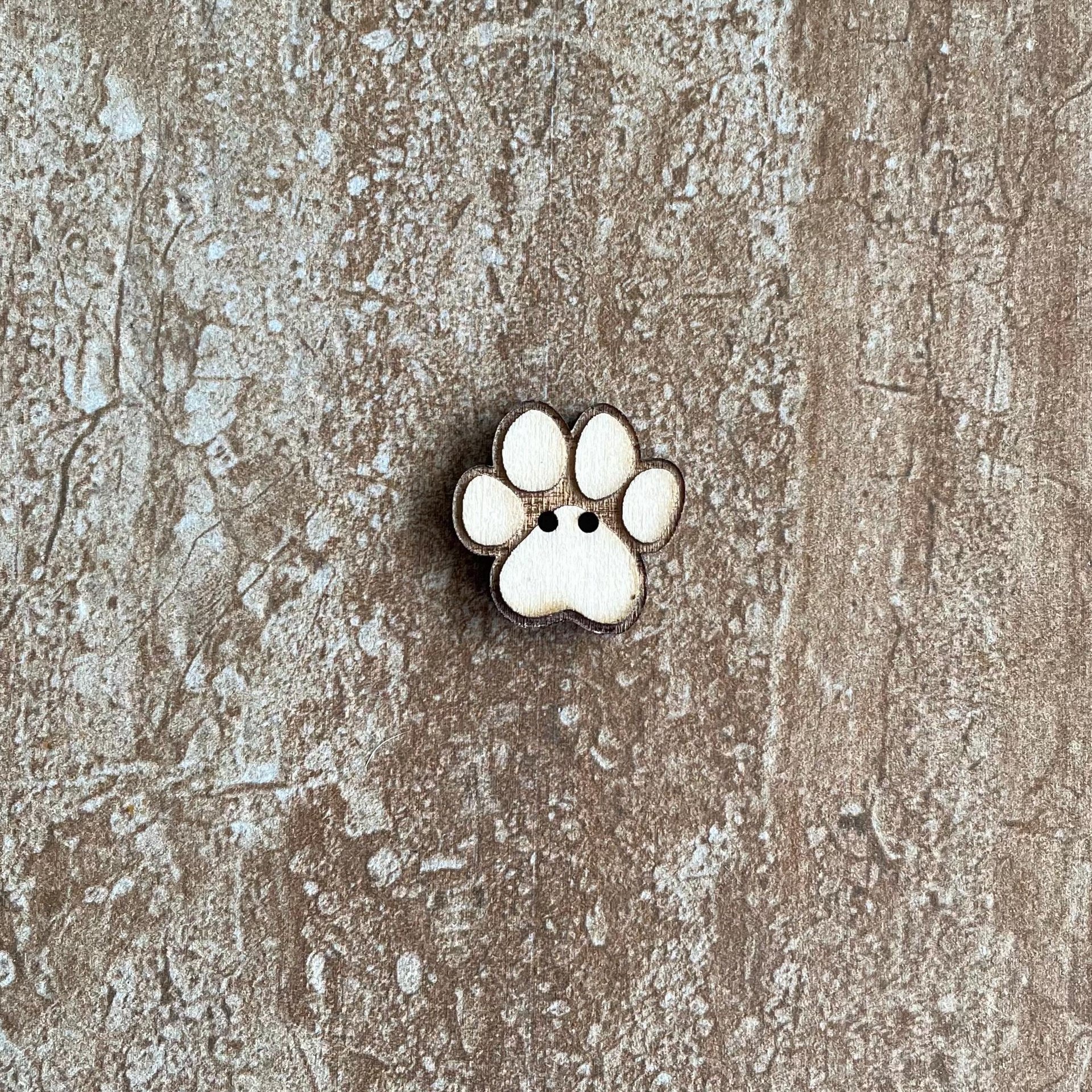 Laser-cut wood paw print buttons for sewing and scrapbooking