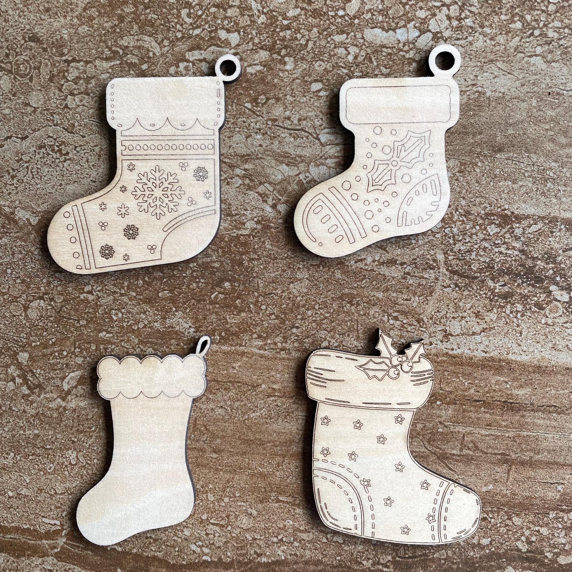 Handmade wooden DIY Christmas stocking cutout in four unique styles, ready for paint or decorating
