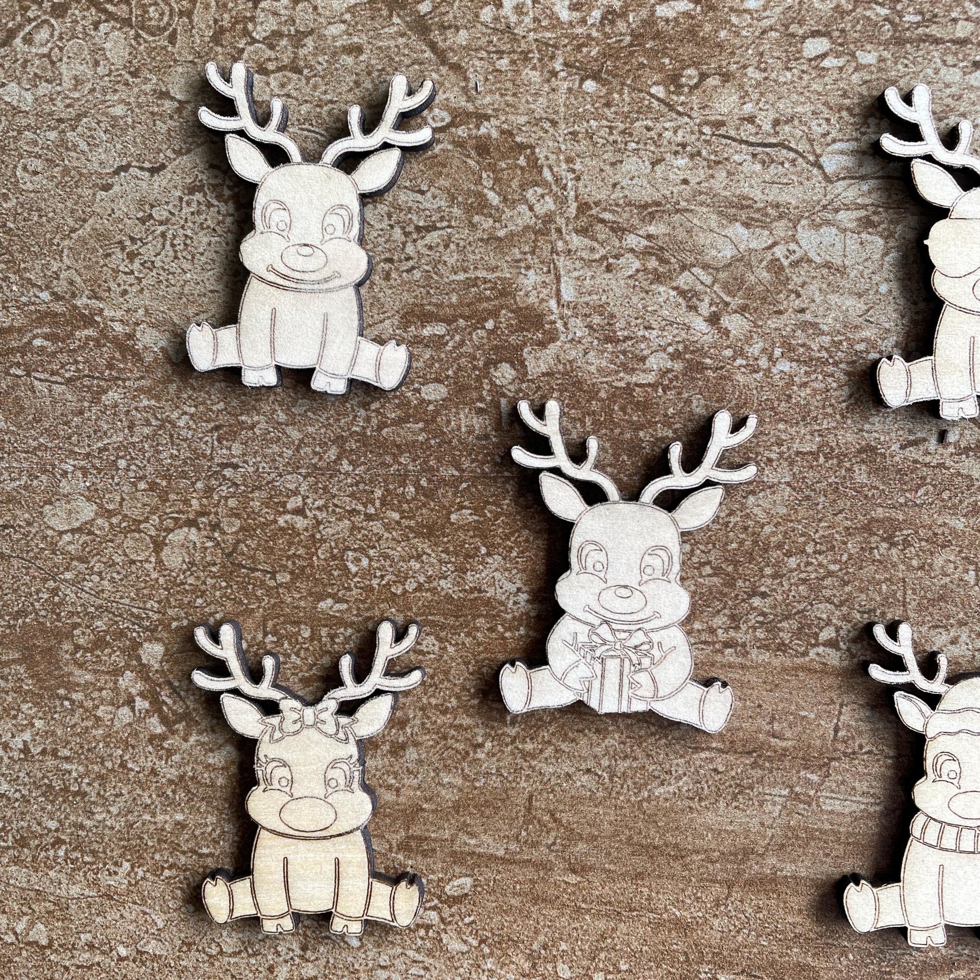 Handmade wooden DIY reindeer cutout in five unique styles, ready for paint or decorating