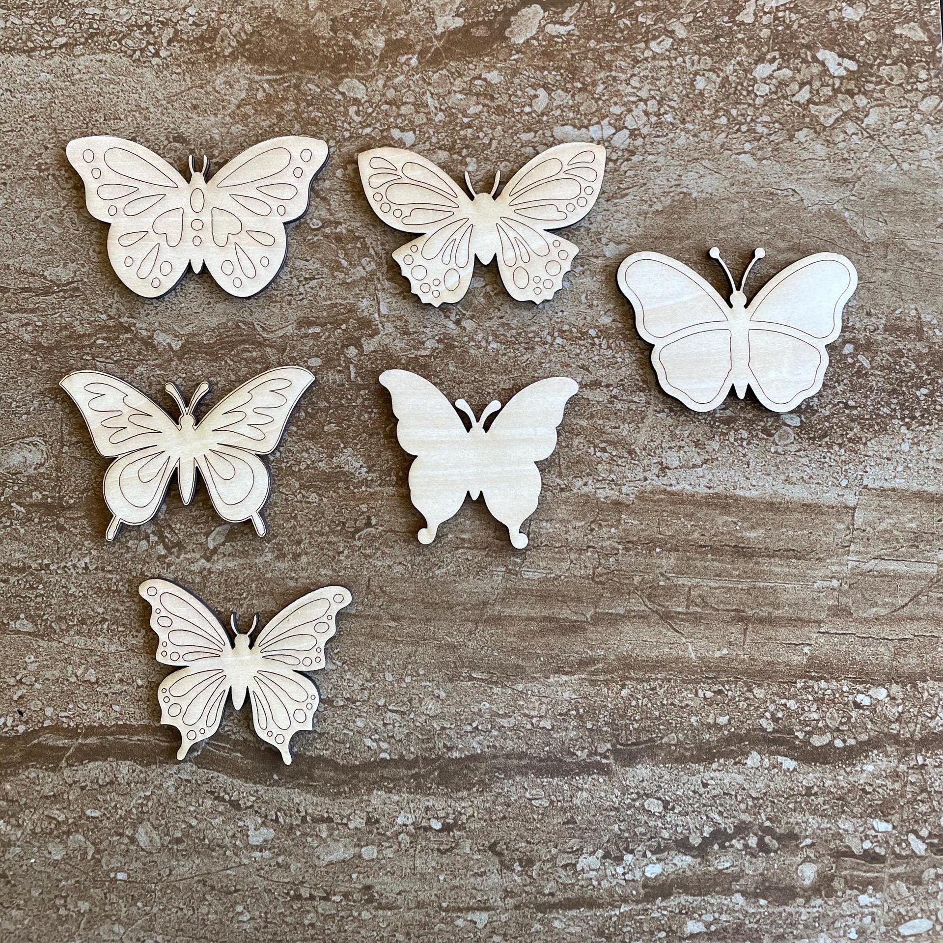 Handmade wooden DIY butterfly cutout in six unique styles, ready to paint or decorate