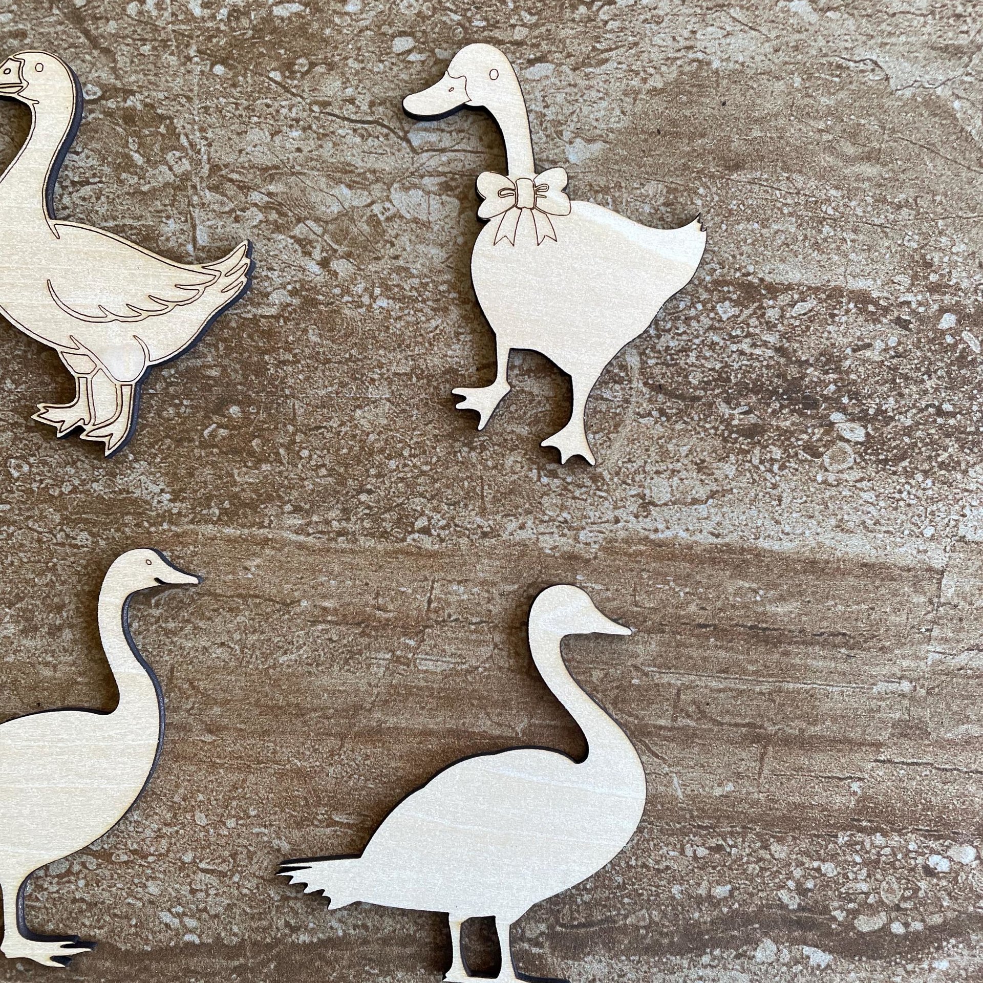 Handmade wooden DIY goose cutout in four unique styles, ready to paint or decorate