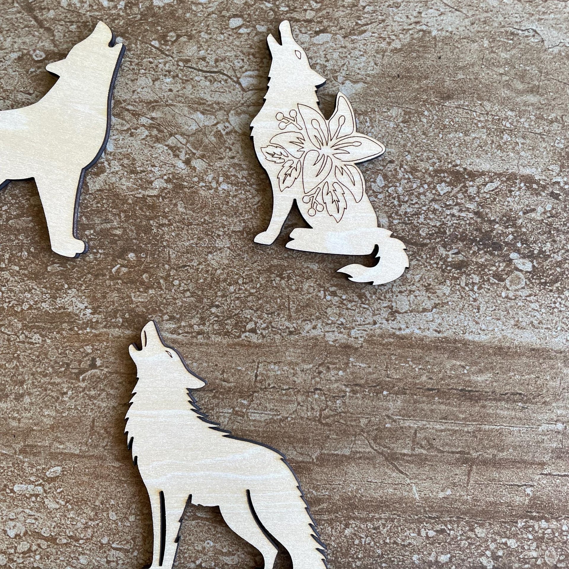 Handmade wooden DIY wolf cutout in three unique styles, ready to paint or decorate