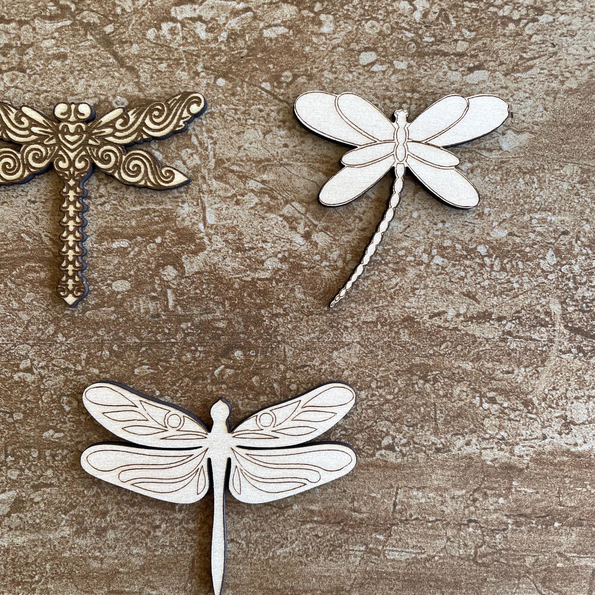 Handmade wooden DIY dragonfly cutout in three unique styles, ready to paint or decorate