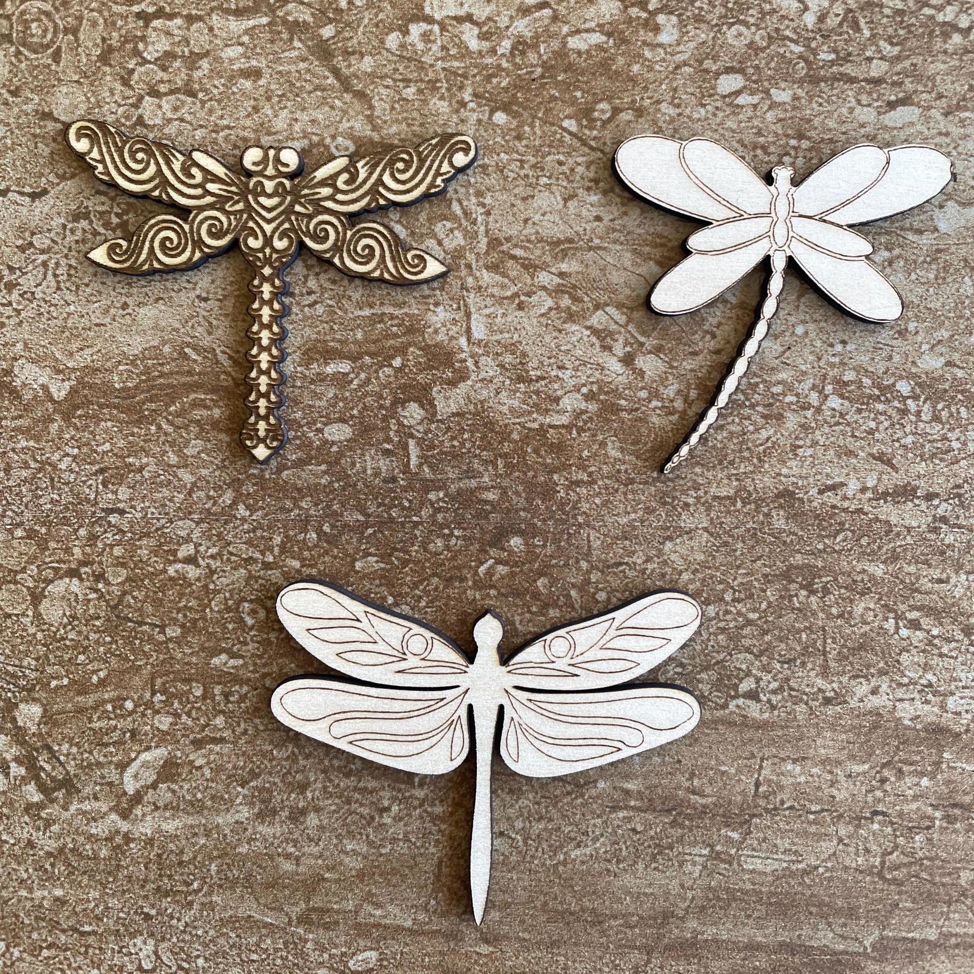 Handmade wooden DIY dragonfly cutout in three unique styles, ready to paint or decorate