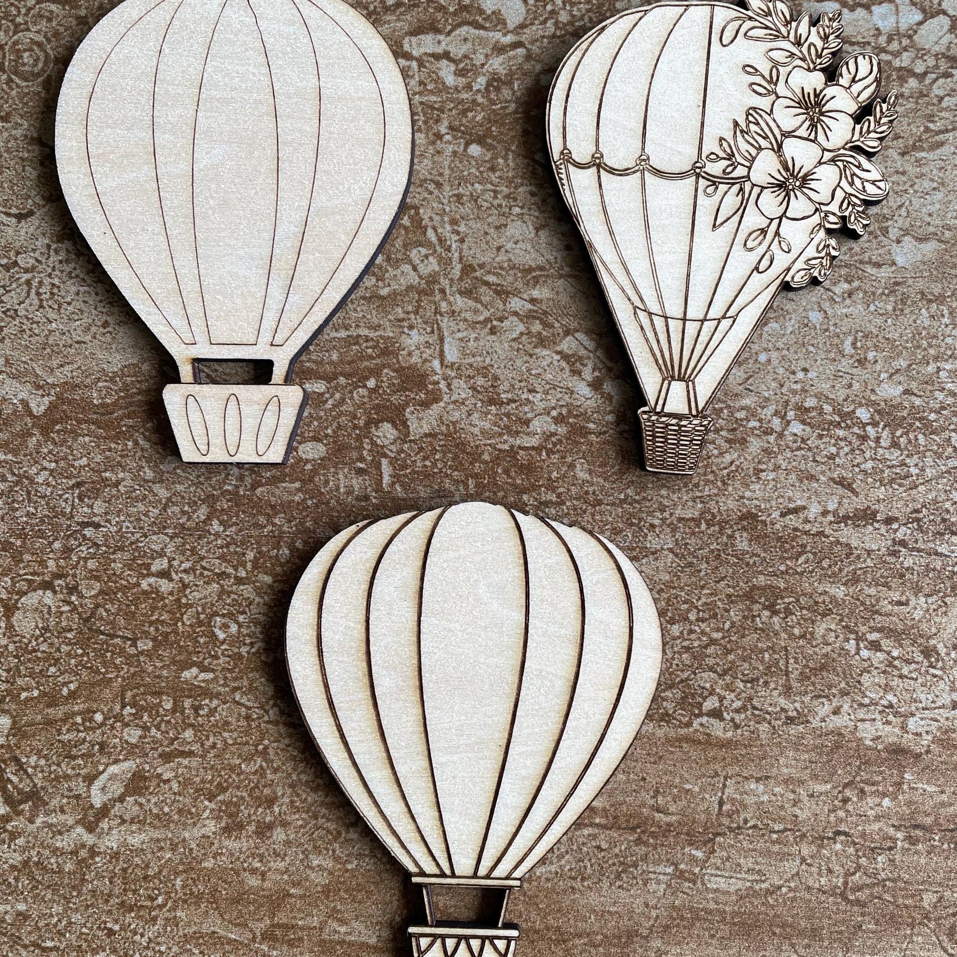 Handmade wooden DIY hot air balloon cutout in three unique styles, ready for paint or decorating
