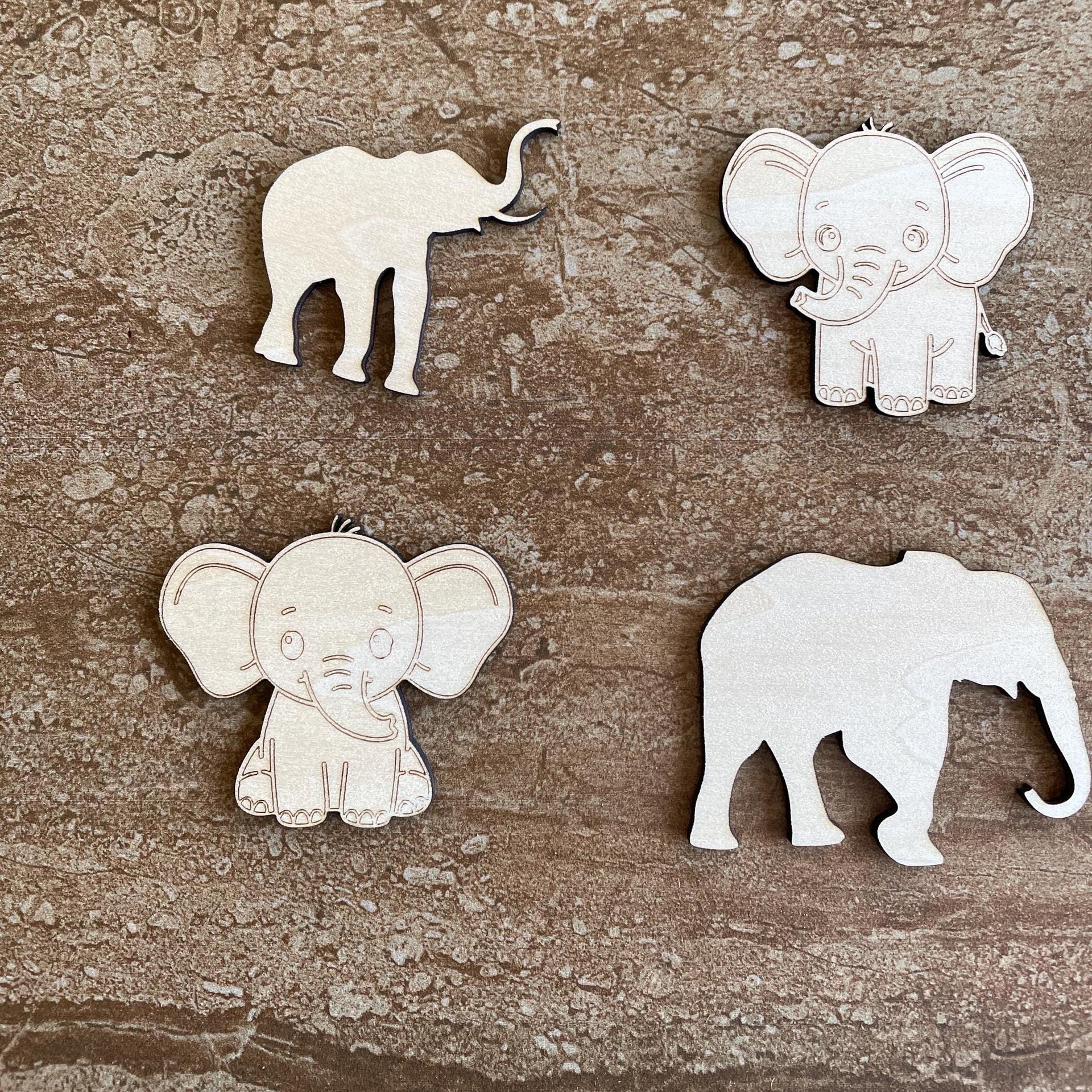 Handmade wooden DIY elephant cutout in four unique styles, ready to paint or decorate