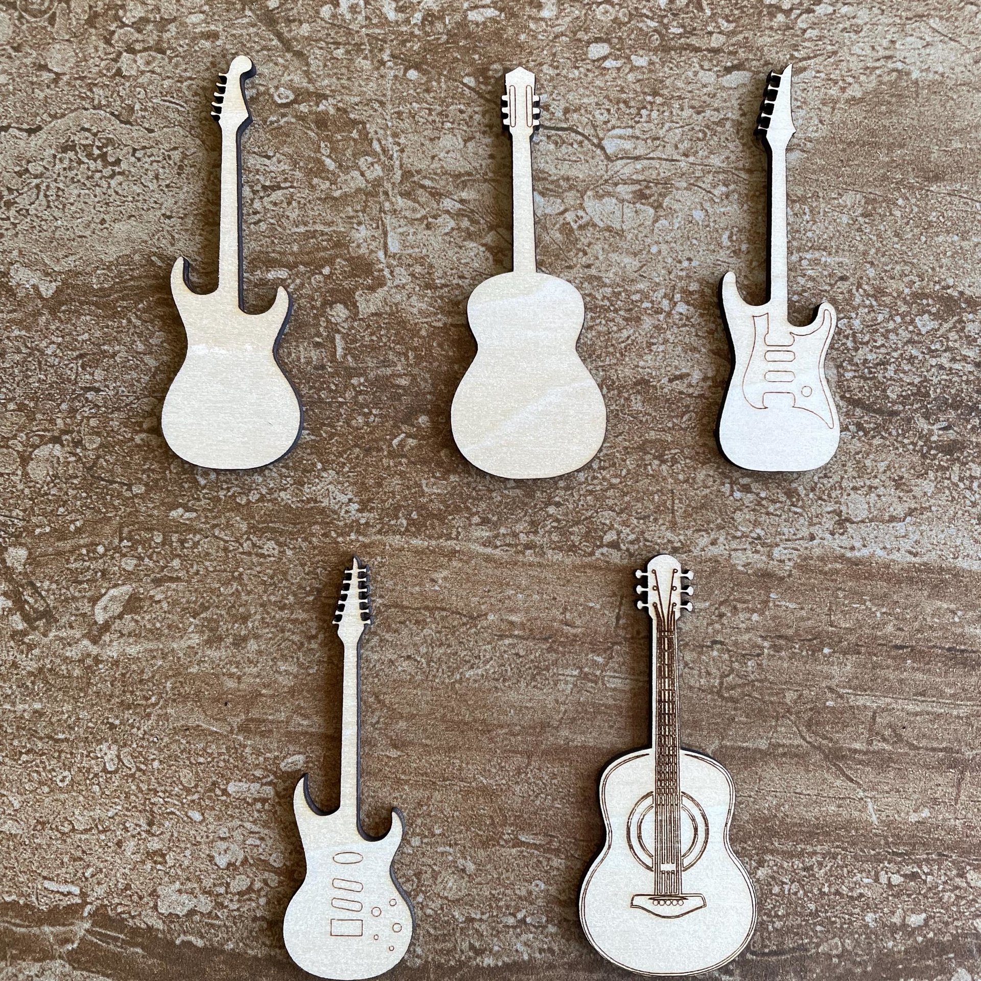 Handmade wooden DIY guitar cutout in five unique styles, ready for paint or decorating