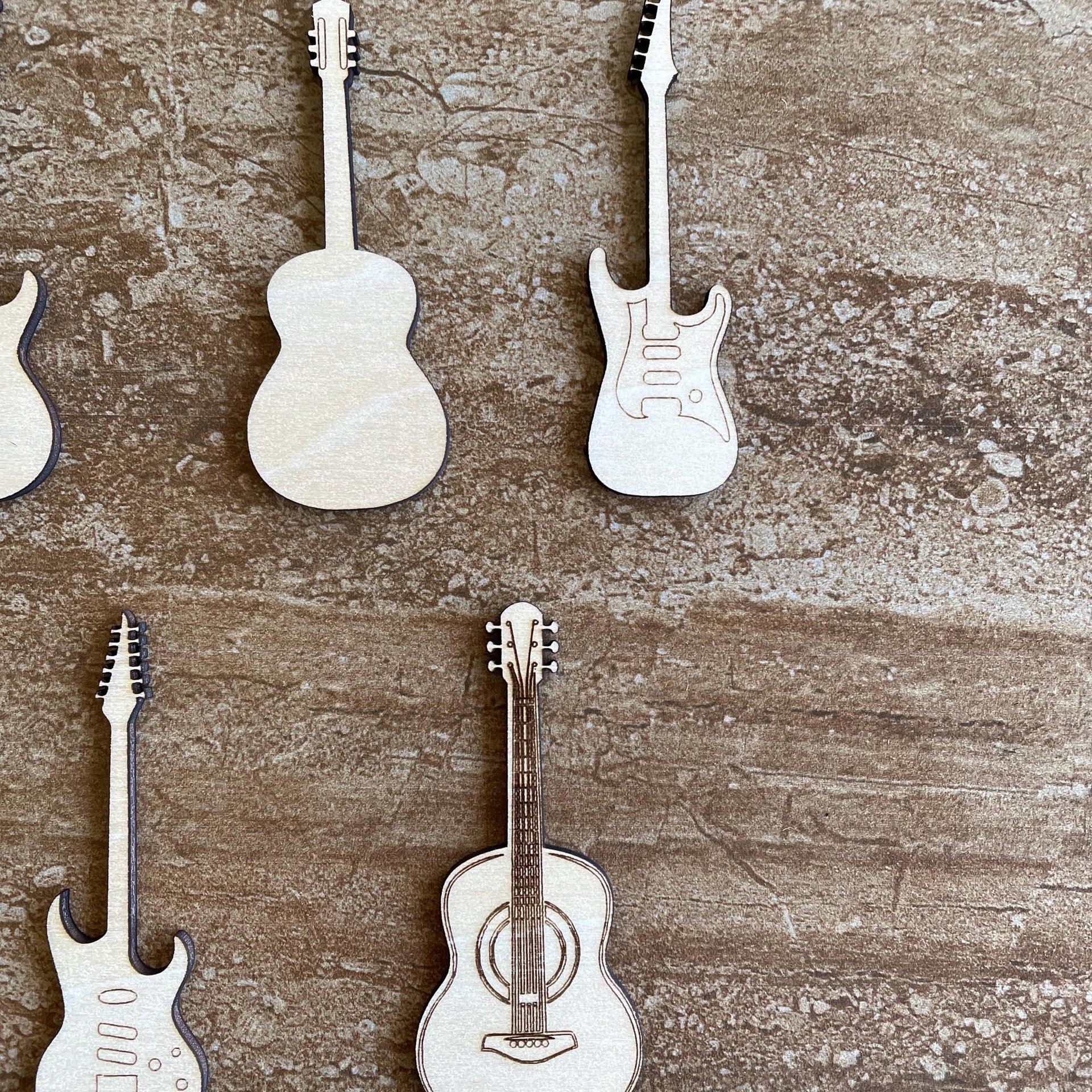 Handmade wooden DIY guitar cutout in five unique styles, ready for paint or decorating