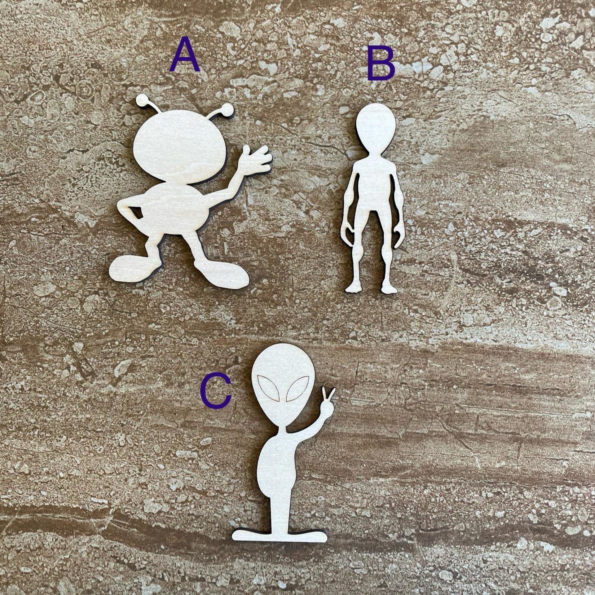 Handmade wooden DIY alien cutout in three unique styles, ready to paint or decorate