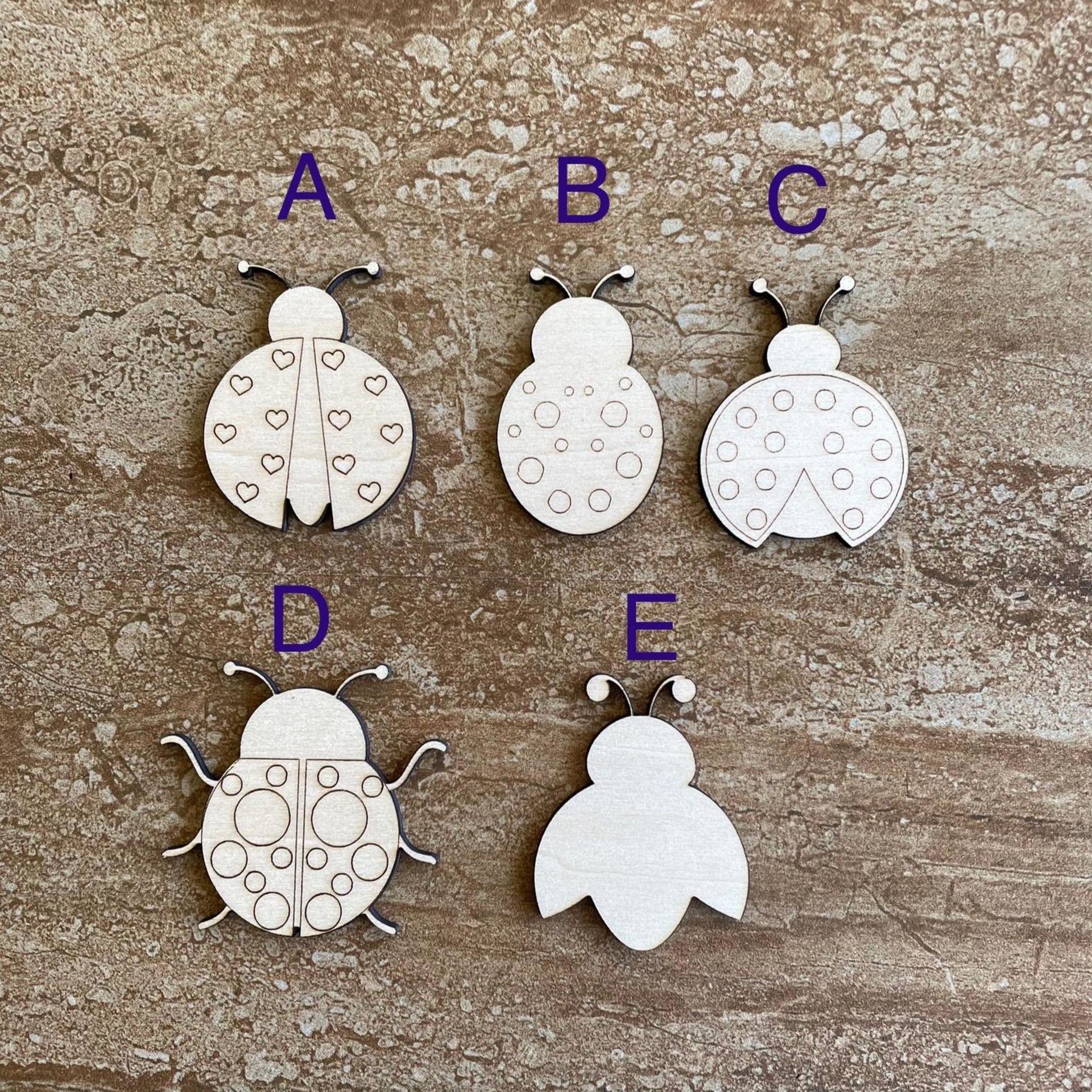 Handmade wooden DIY ladybug cutout in five unique styles, ready to paint or decorate