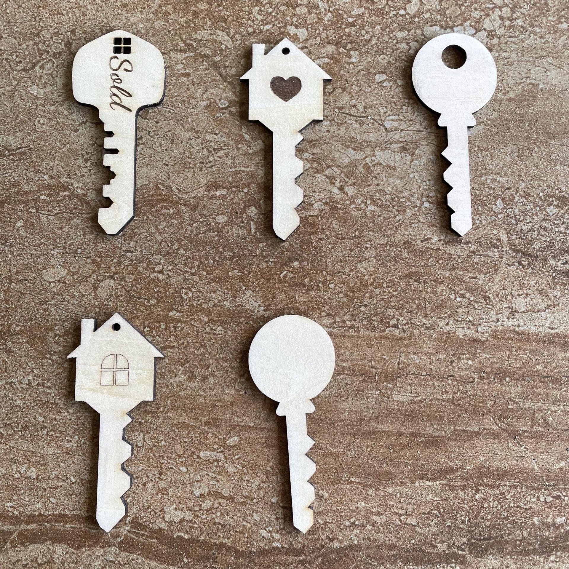 Handmade wooden DIY key cutout in five unique styles, ready for paint or decorating