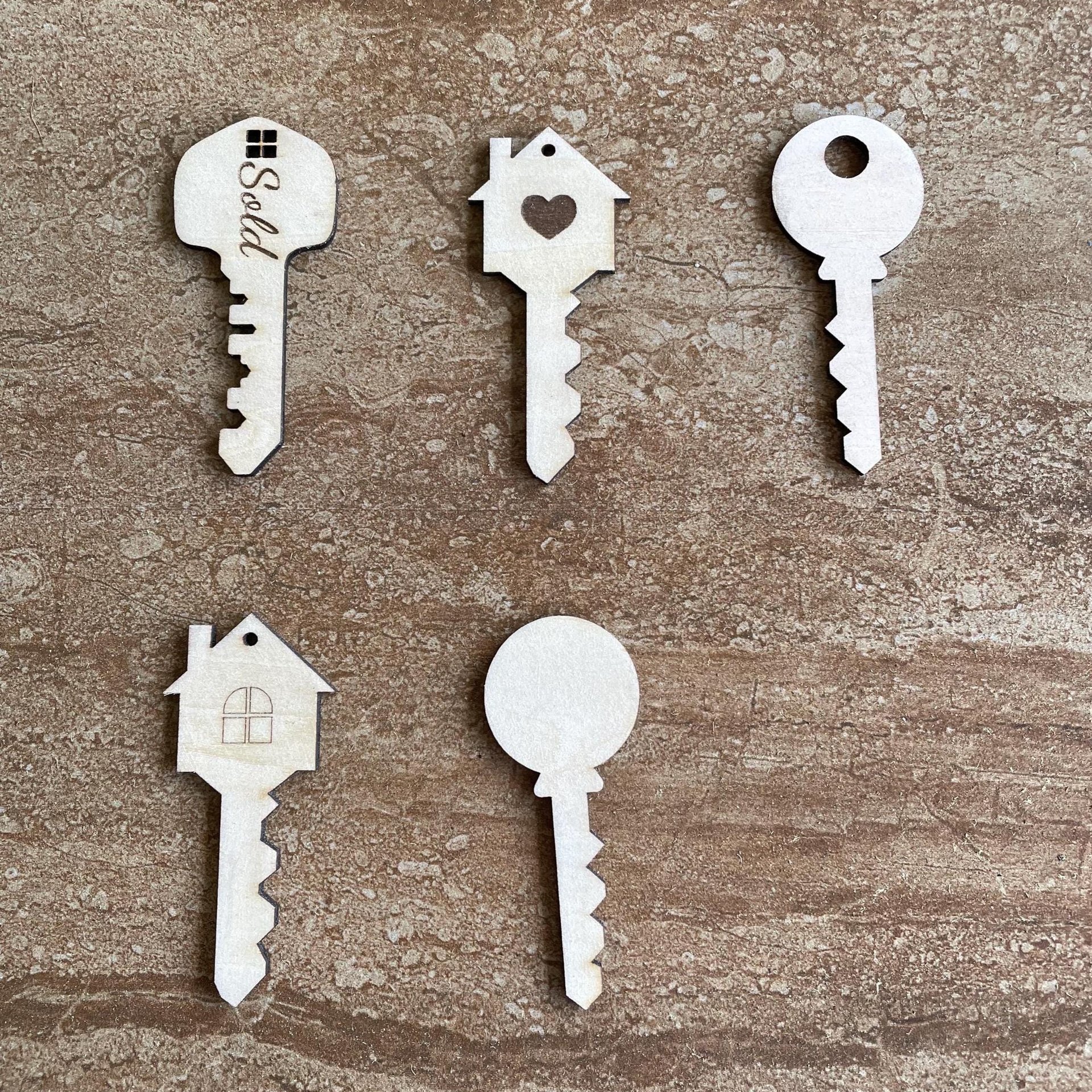 Handmade wooden DIY key cutout in five unique styles, ready for paint or decorating
