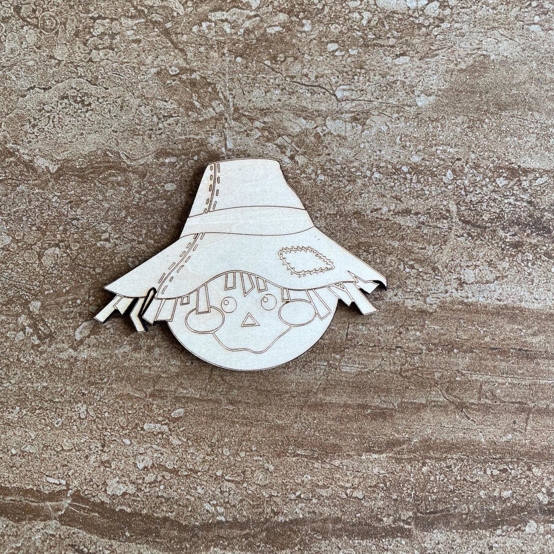 Handmade wooden DIY scarecrow cutout ready for paint or decorating