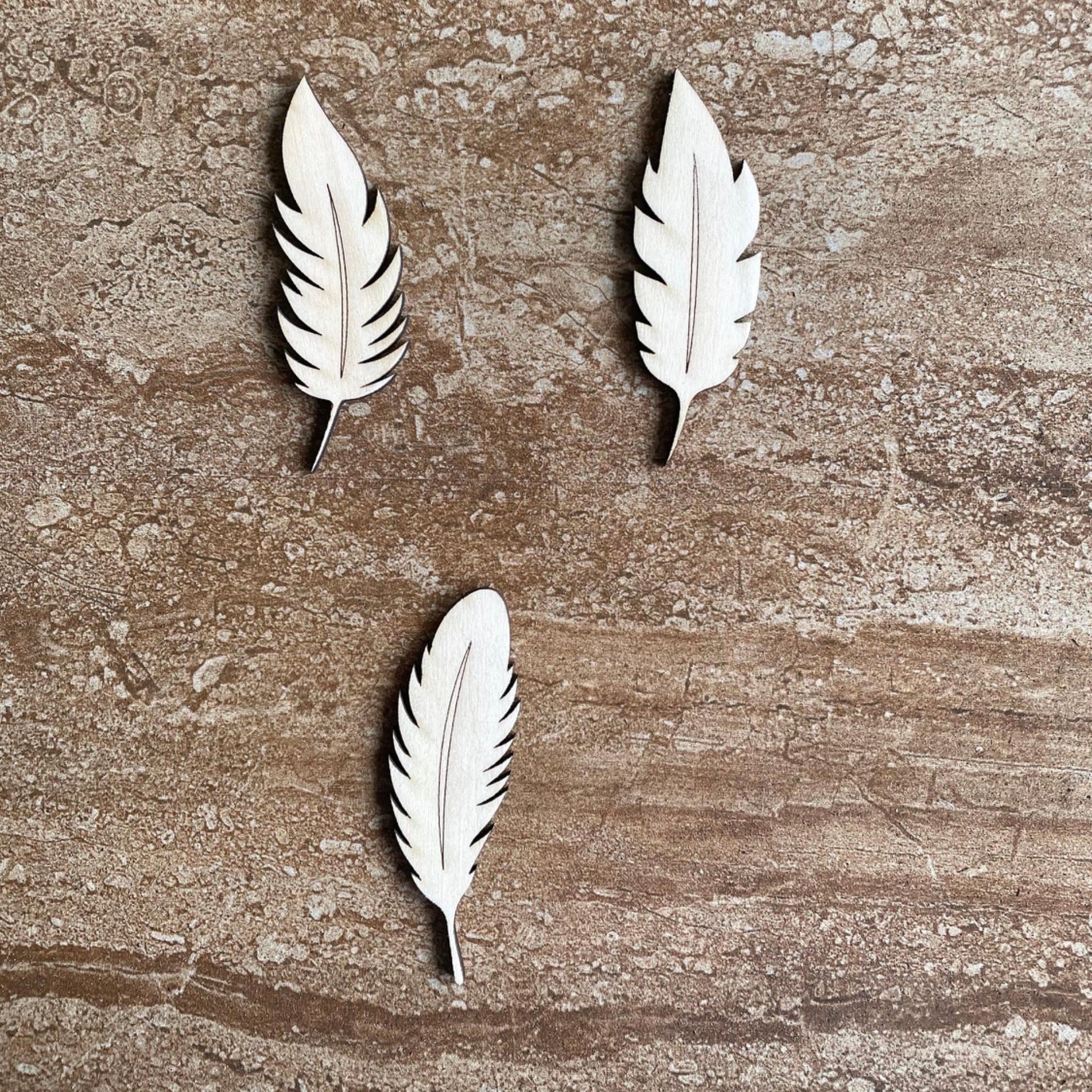 Handmade wooden DIY feather cutout in three unique styles, ready for paint or decorating