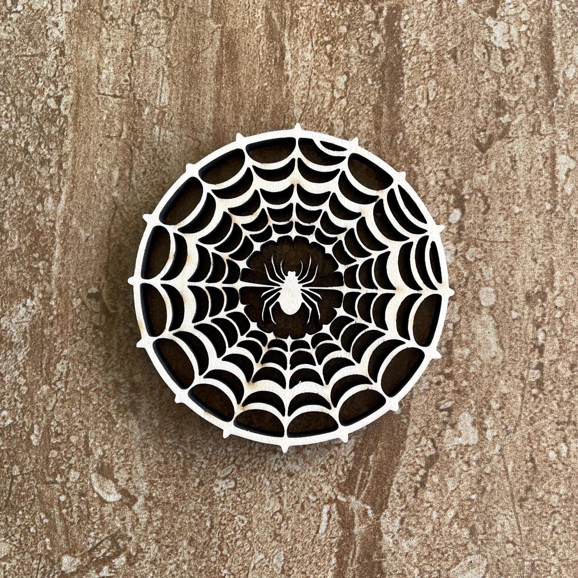 Handmade wooden DIY spider web cutout ready for paint or decorating