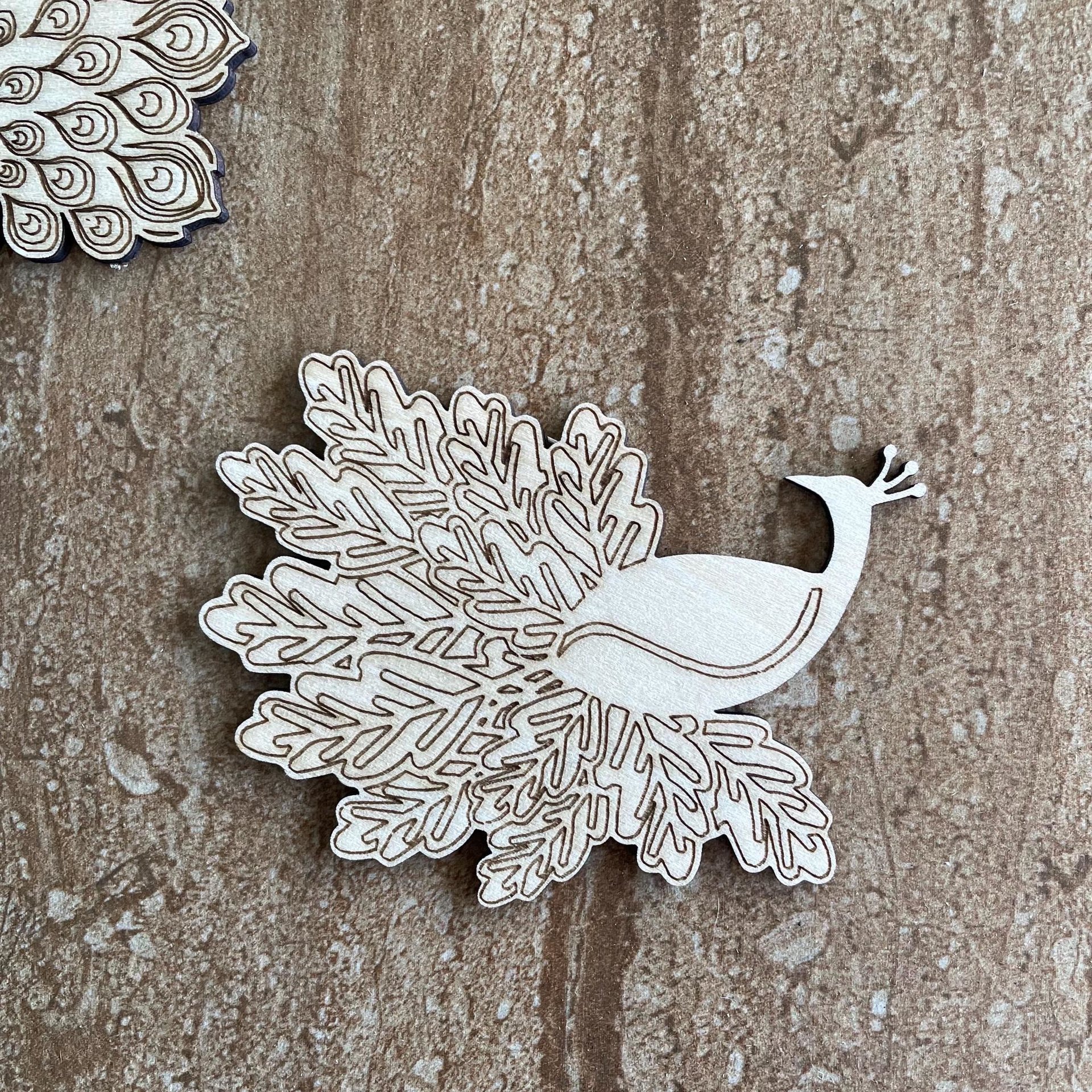 Handmade wooden DIY peacock cutout in two unique styles, ready to paint or decorate