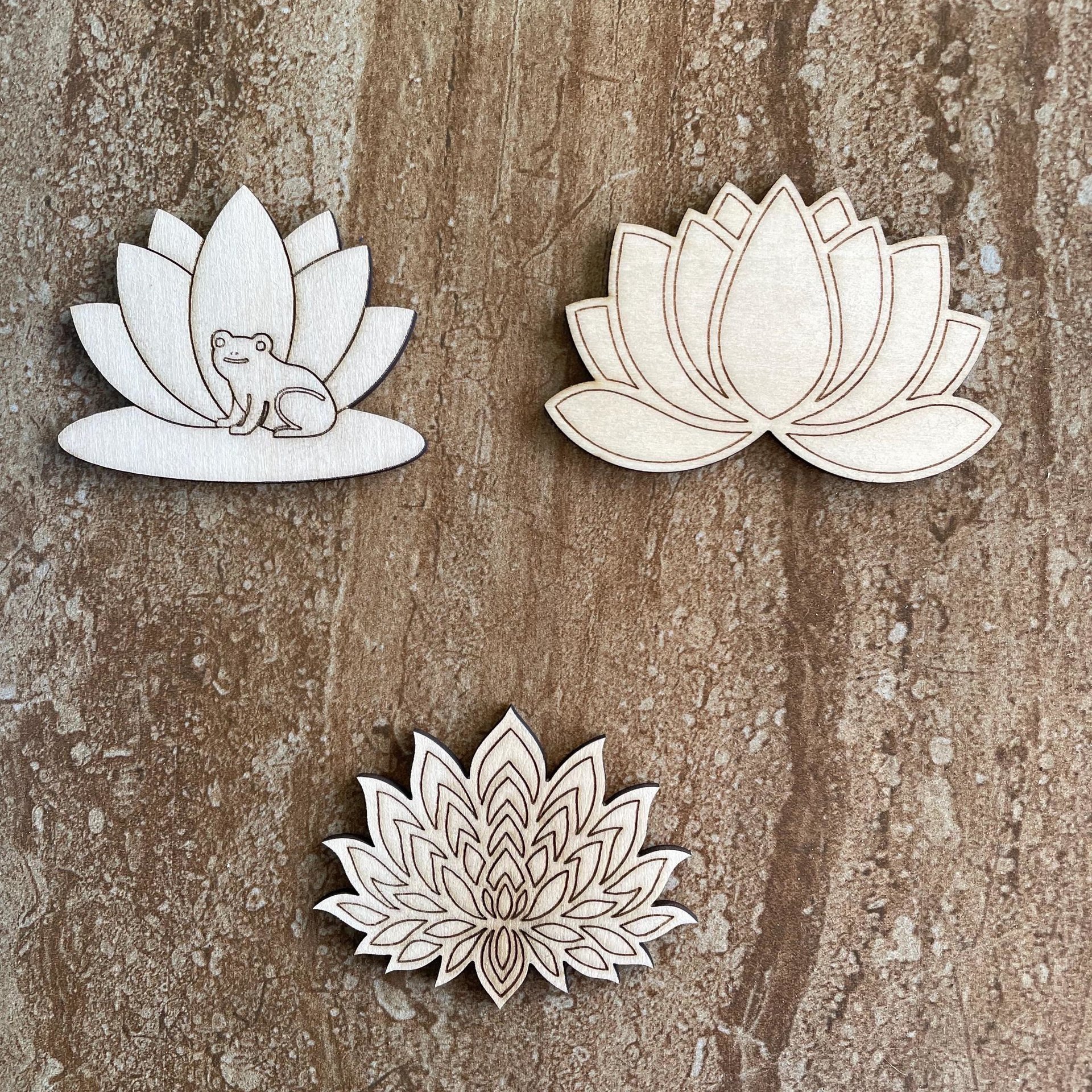 Handmade wooden DIY lotus flower cutouts in three unique styles, ready for paint or decorating