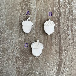 Handmade wood acorn cutouts in three DIY craft styles