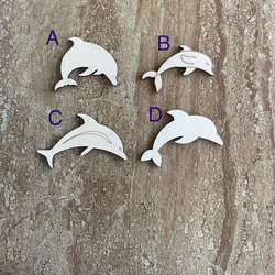 Handmade wood dolphin cutouts in four unique DIY craft styles