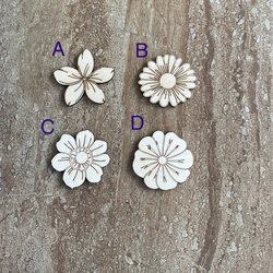 Handmade wood DIY flower cutouts in four different styles for crafts and painting projects