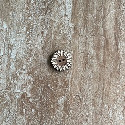 Handmade wooden sunflower buttons with detailed petals for craft projects