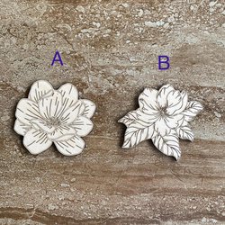 Handmade wooden DIY magnolia flower cutouts in two unique styles, ready for paint or decorating