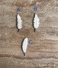 Handmade wooden DIY feather cutout in three unique styles, ready for paint or decorating